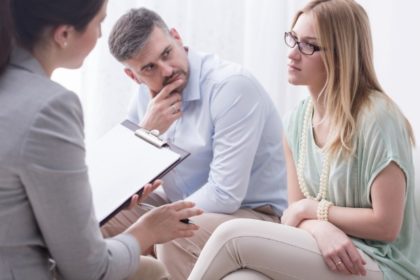 man looking at his wife in mediation