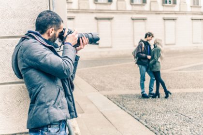 Photographer taking photo of a couple