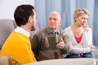 Grandparents speaking with grandson