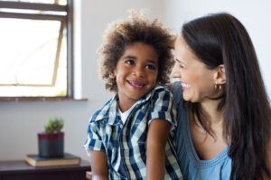 Happy parent and child find an adoption lawyer