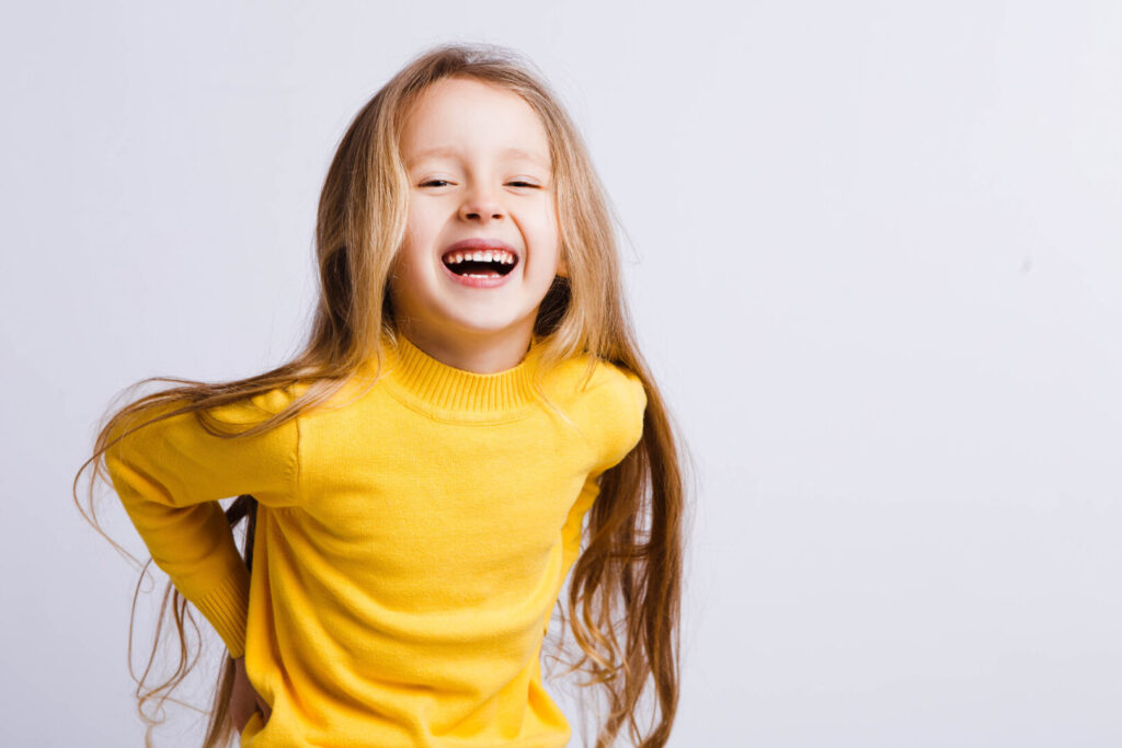 Cute girl 4-5 year old posing in studio. Original, square photo with space for text.
