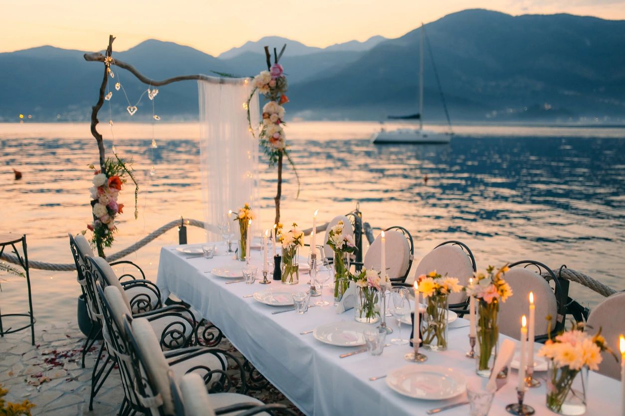 table set on the beach for a wedding